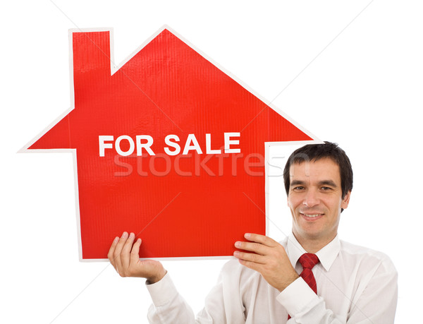 salesman with house for sale sign stock photo 08 ilona75