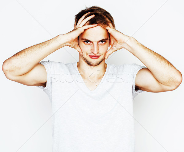 stock photo: young handsome teenage hipster guy posing emotional