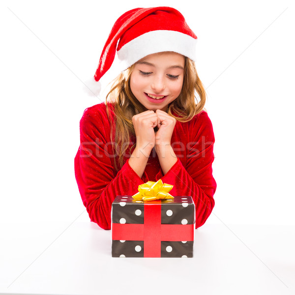 stock photo: christmas santa kid girl happy excited with ribbon