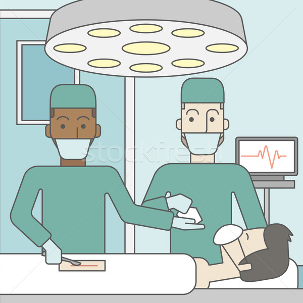 商业照片: 二 外科医生  工作的 看 病人  手术室