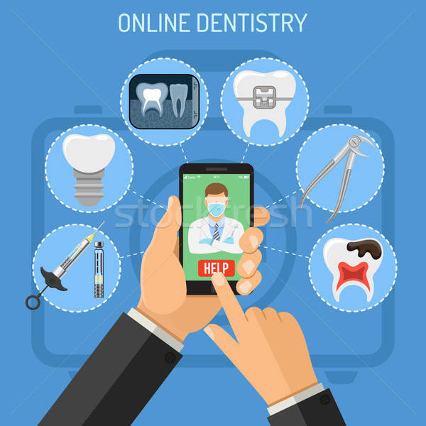 Online stomatologia ikona ręce smartphone dentysta Zdjęcia stock © -TAlex-