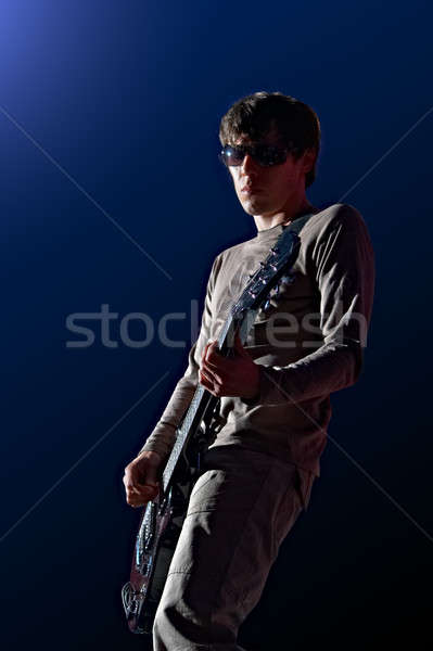 Guitariste homme guitare bleu fond métal [[stock_photo]] © 26kot