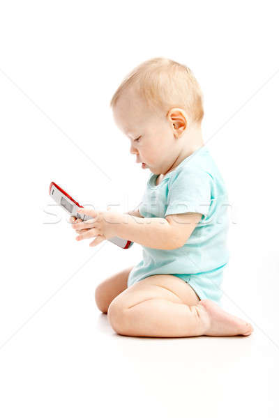 Cute kind praten mobiele telefoon geïsoleerd witte Stockfoto © 26kot