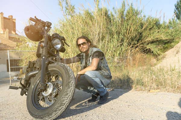 брюнетка парень позируют черный мотоцикл Сток-фото © 2Design