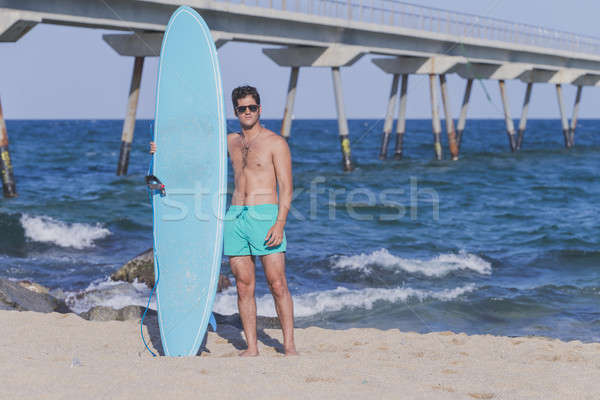 Surfer niebieski deska surfingowa plaży człowiek Zdjęcia stock © 2Design