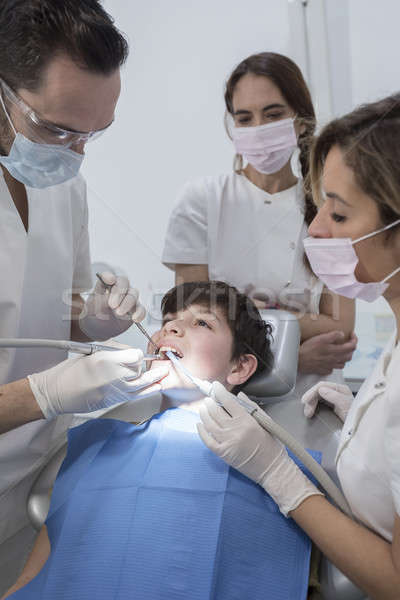 A portrait of a dentist with his team working Stock photo © 2Design