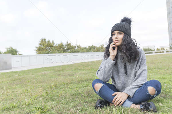 portrait of a woman with wool cap and sweater in park Stock photo © 2Design