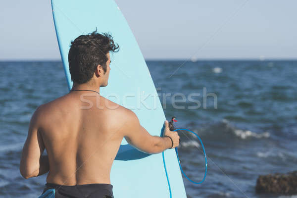 Surfer halten blau Surfbrett Strand Himmel Stock foto © 2Design