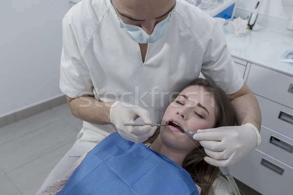 A portrait of a dentist with his team working Stock photo © 2Design
