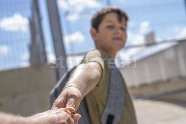 Cheerful child carrying his backpack standing in front of the sc Stock photo © 2Design