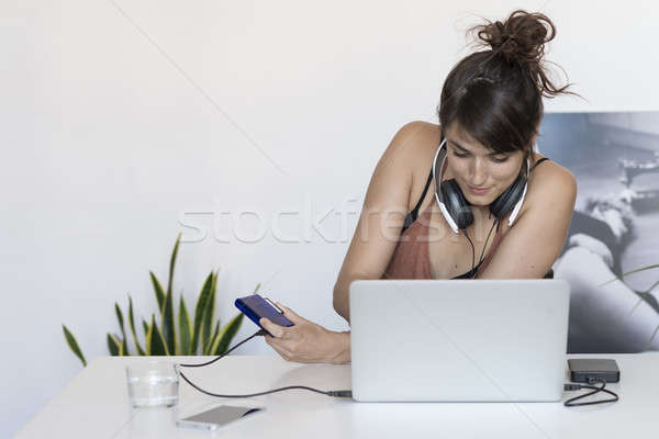  Businesswoman working on her laptop at work Stock photo © 2Design