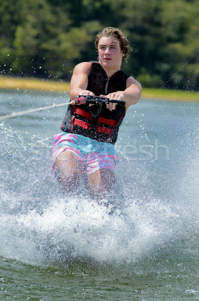 [[stock_photo]]: Teen · garçon · eau · ski · astuce