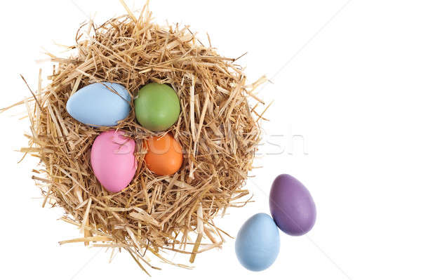 Straw nest with nice colored Easter eggs Stock photo © 3523studio