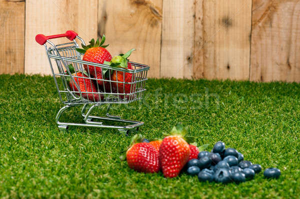 Blueberries and Strawberries in a shopping cart Stock photo © 3523studio