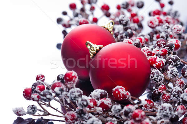 Two Christmas baubles and holly berries Stock photo © 3523studio