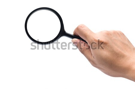 hand holds a magnifying glass with clipping paths Stock photo © 3523studio