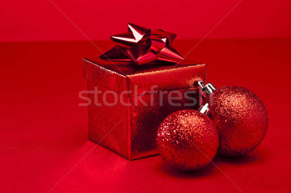 Red bauble and Christmas present  Stock photo © 3523studio