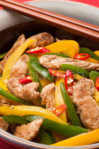 Fried Chicken with capsicum on red table cloth Stock photo © 3523studio