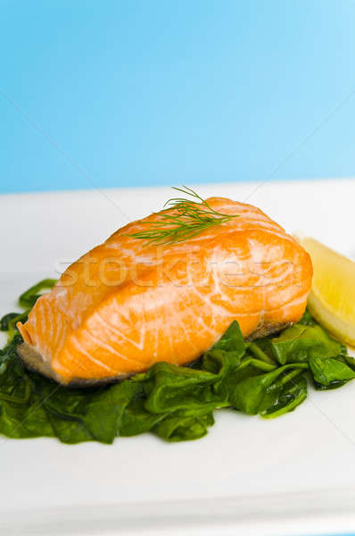 Salmon steak on pasta, decorated with lemon Stock photo © 3523studio