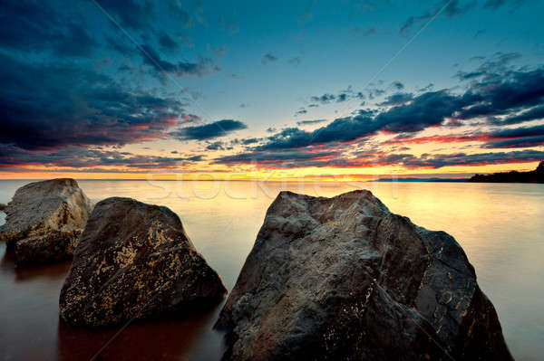 Sea at sunset with motion blur ocean Stock photo © 3523studio