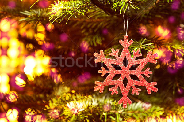 Red snow flake in a christmas tree with neon colors Stock photo © 3523studio