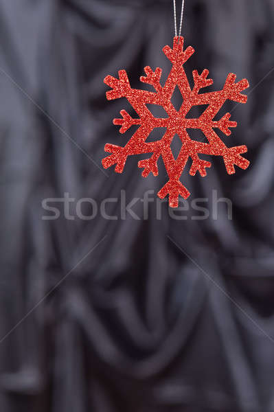 Red snow flake on a black background Stock photo © 3523studio