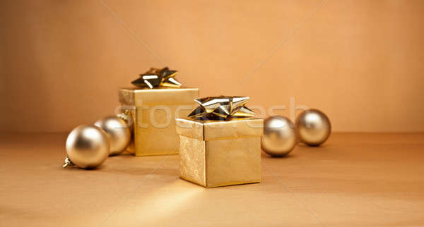 Gold bauble and present Stock photo © 3523studio