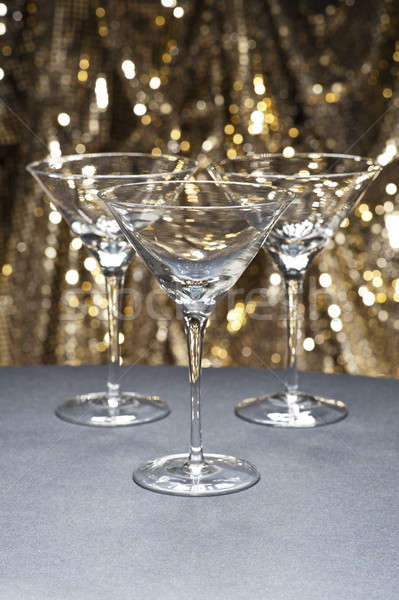 Three Martini glasses in front of glitter background Stock photo © 3523studio