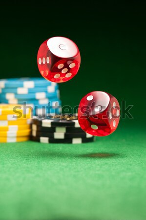 Rolling red dice on a casino table Stock photo © 3523studio