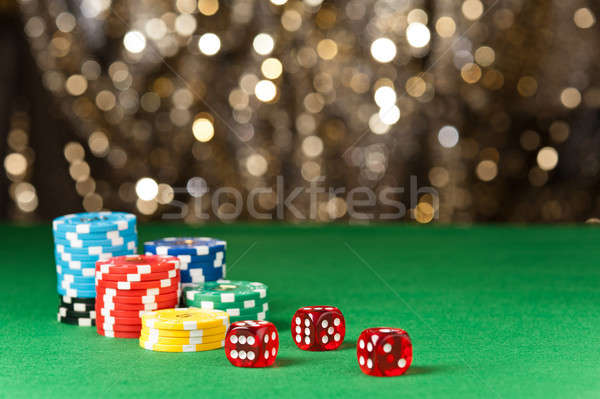 Stock photo: Colorful poker chips and red dice