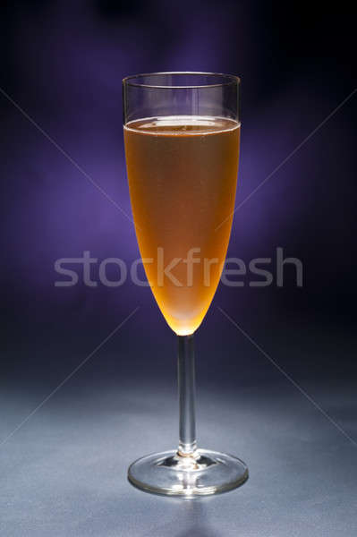 Champaign glass in front of blue purple background Stock photo © 3523studio