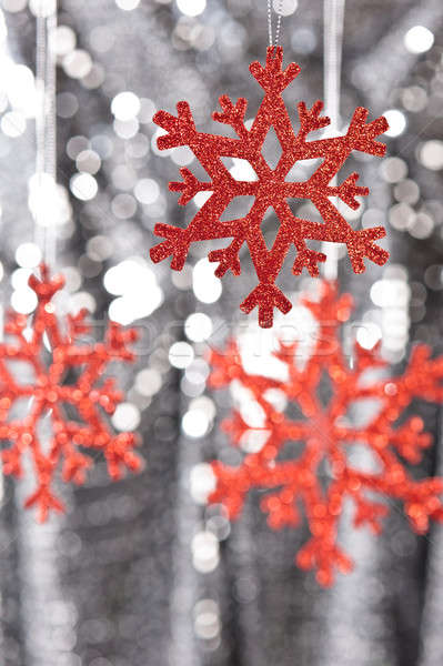 Red snow flake on a silver glitter background Stock photo © 3523studio