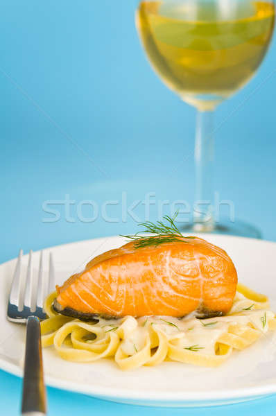 Salmon steak on pasta, decorated with dill Stock photo © 3523studio