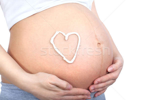 Pregnant woman holding her belly Stock photo © 3dvin