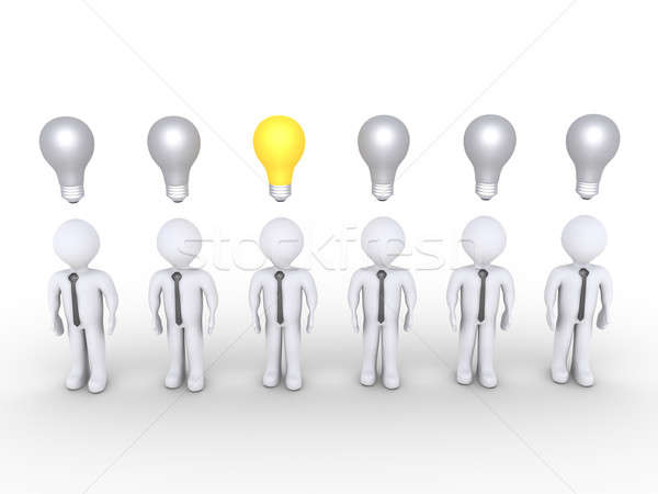 Stock photo: Businessman stands out of others with lightbulb