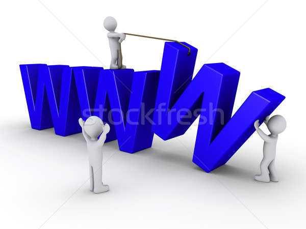 Stock photo: Three people work to set up a website