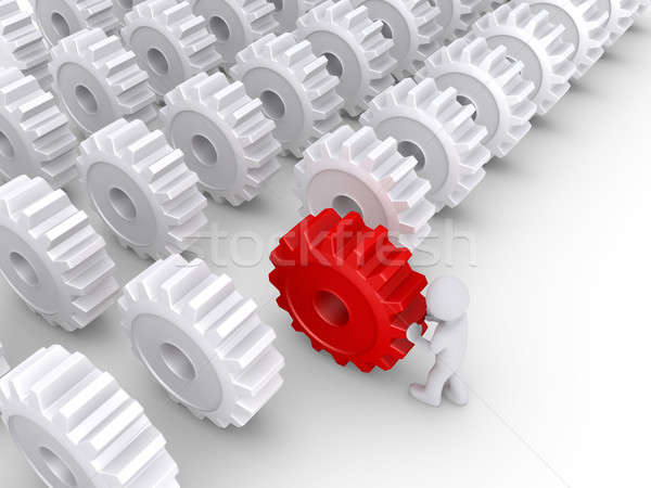 Person pushing a cogwheel to be in front Stock photo © 6kor3dos