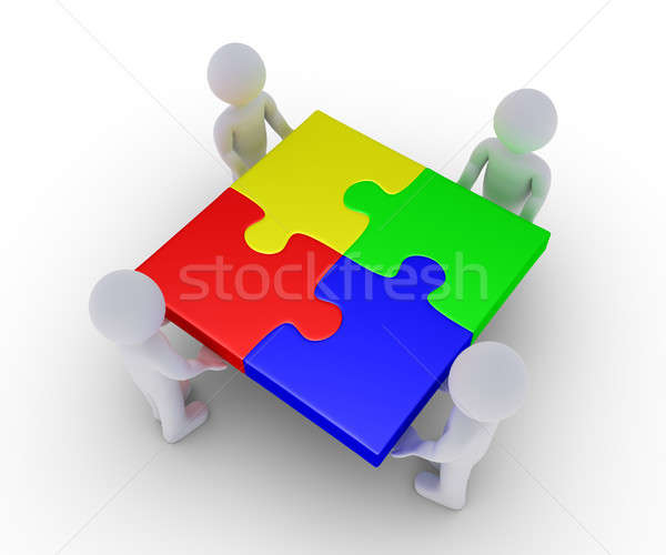 Four people holding completed puzzle Stock photo © 6kor3dos