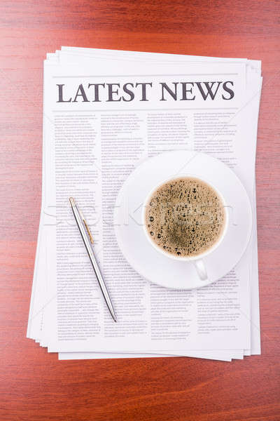 The newspaper LATEST NEWS on table  and coffee Stock photo © a2bb5s