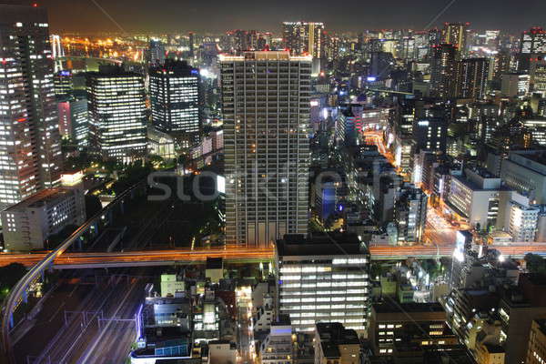 Tokió éjszaka panoráma megvilágított felhőkarcolók üzlet Stock fotó © AchimHB