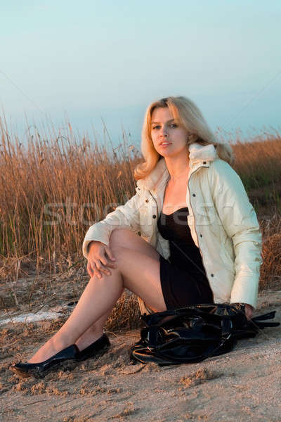 Stock photo: Girl sitting on the beach