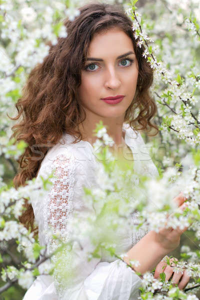 Fiatal csábító barna hajú portré pózol virágzó Stock fotó © acidgrey