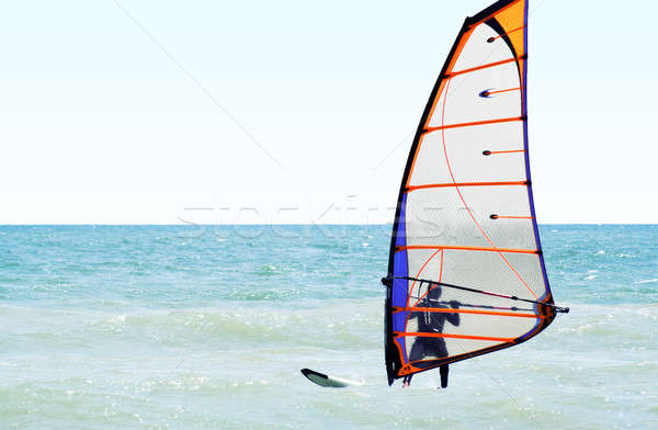 Silhouette of a windsurfer on the sea in the afternoon Stock photo © acidgrey