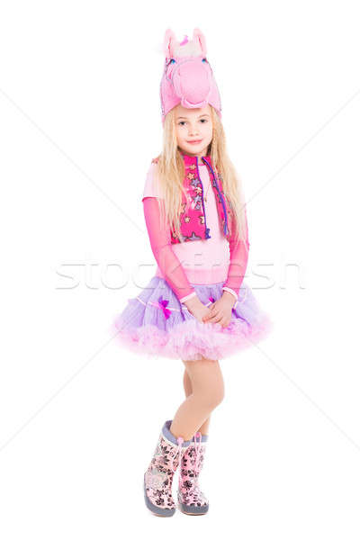 Gyönyörű lány pózol rózsaszín póni öltöny izolált Stock fotó © acidgrey