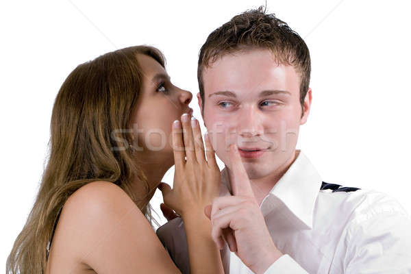 Stock photo: The young woman whispers on an ear to the young man