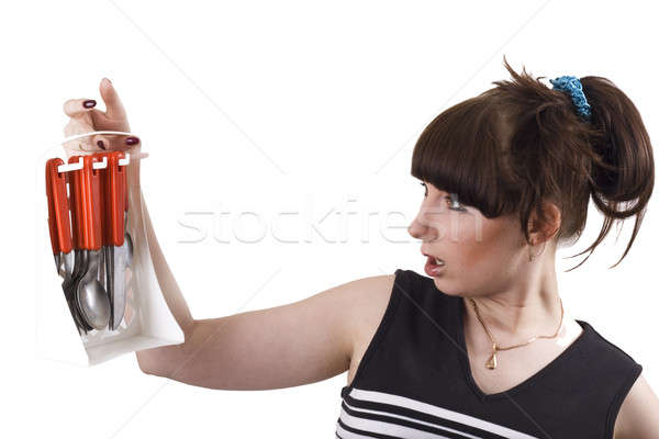 The mad housewife with knifes, spoons, plugs. funny picture Stock photo © acidgrey