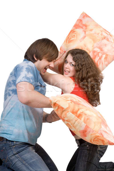 The young couple fights pillows. Isolated Stock photo © acidgrey