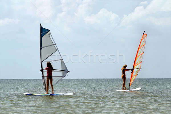 Two girls windsurfers Stock photo © acidgrey