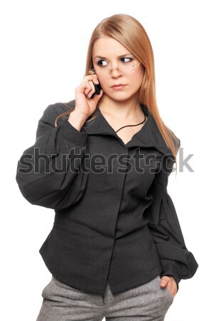 Portrait of dissatisfied young blonde in a gray business suit Stock photo © acidgrey
