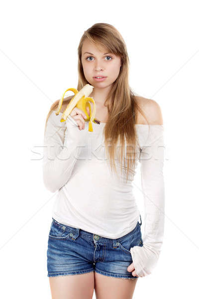 Woman holding banana   Stock photo © acidgrey